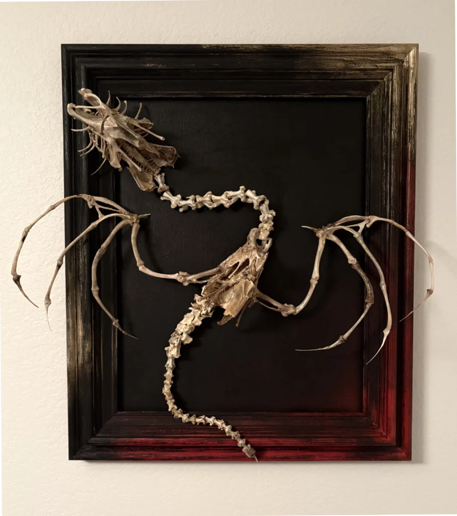 A high-definition close-up of The Beithir, showcasing the intricate biological textures of the hand-cleaned bones and the detailed metal articulation.